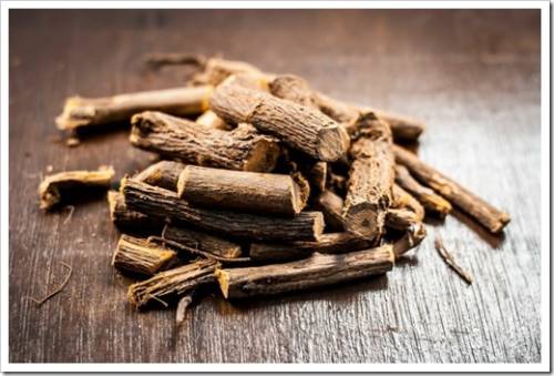 Close up of Ayurvedic herb Liquorice root,Licorice root, Mulethi or Glycyrrhiza glabra root on a wooden surface is very much beneficial for Soothes your stomach,poisoning, stomach ulcers, etc.